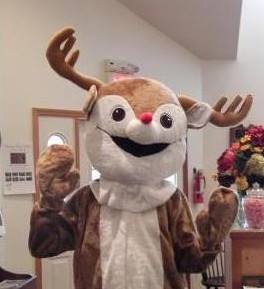 Costumed person wearing a reindeer costume