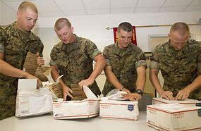 soldiers opening packages