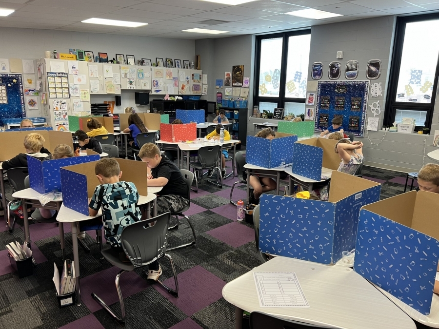 Students using desk blinders to focus on test