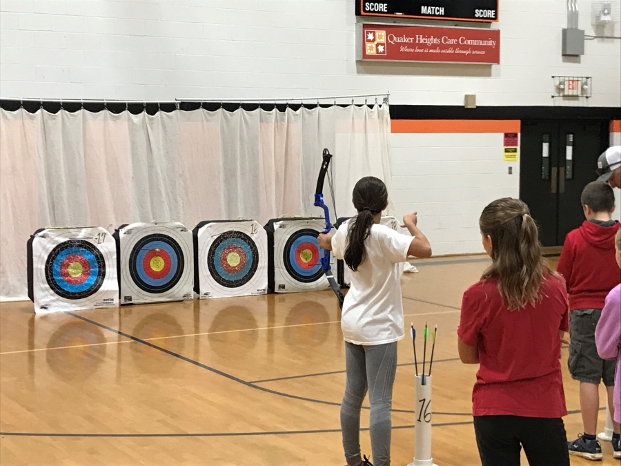 girl shooting at archery targets
