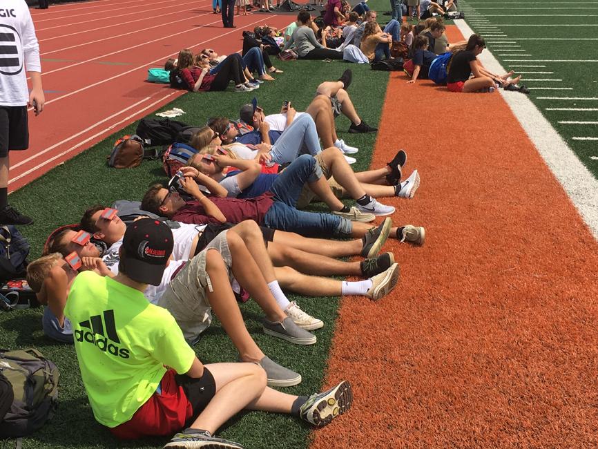 image of students watching eclipse