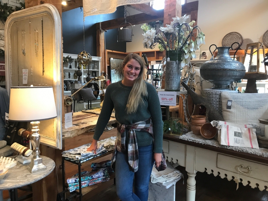 girl standing in a retail store with home decor